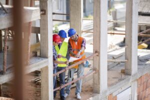 Young architect give suggestion to colleagues at construction site